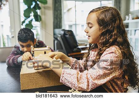 Mixed race children building model house View Large Photo Image Stock Image - Mixed race children building model house. Fotosearch