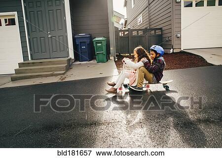 Stock Photo - Mixed race children playing outdoors. Fotosearch