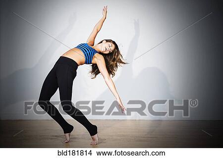 Picture - Mixed race dancer practicing in studio. Fotosearch