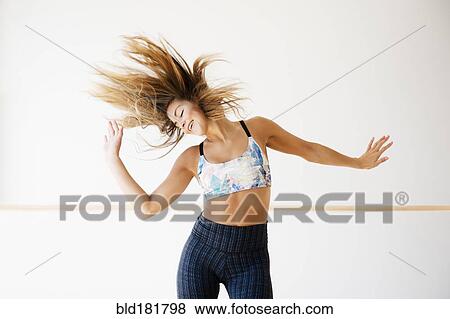 Stock Photo - Mixed race dancer practicing in studio. Fotosearch
