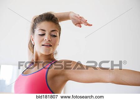Mixed race dancer practicing in studio View Large Photo Image Stock Photo - Mixed race dancer practicing in studio. Fotosearch