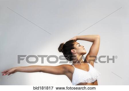 Stock Photo - Mixed race dancer practicing in studio. Fotosearch