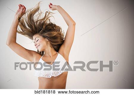 Stock Photo - Mixed race dancer practicing in studio. Fotosearch