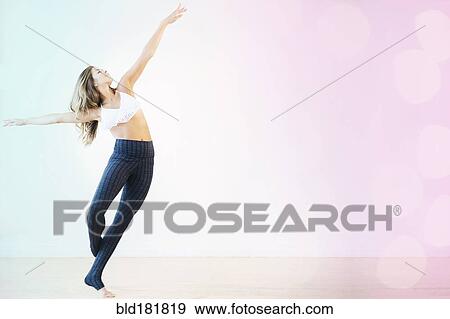 Stock Photo - Mixed race dancer practicing in studio. Fotosearch