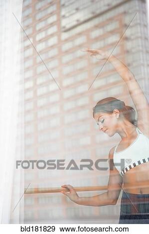 Stock Photo - Mixed race dancer practicing in studio. Fotosearch