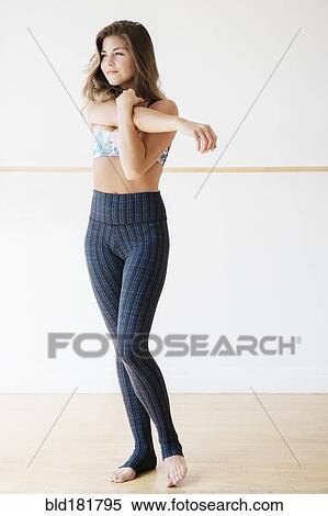 Mixed race dancer stretching in studio View Large Photo Image Stock Photography - Mixed race dancer stretching in studio. Fotosearch