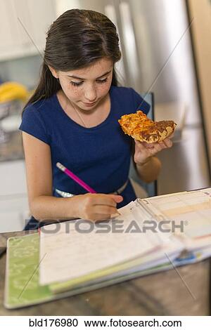 Mixed race girl doing homework View Large Photo Image Stock Image - Mixed race girl doing homework. Fotosearch
