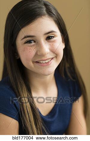 Picture - Mixed race girl smiling. Fotosearch