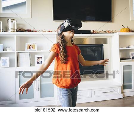 Mixed race girl using virtual reality goggles View Large Photo Image Stock Image - Mixed race girl using virtual reality goggles. Fotosearch
