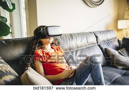 Mixed race girl using virtual reality goggles View Large Photo Image Stock Photo - Mixed race girl using virtual reality goggles. Fotosearch