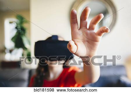 Mixed race girl using virtual reality goggles View Large Photo Image Stock Photo - Mixed race girl using virtual reality goggles. Fotosearch