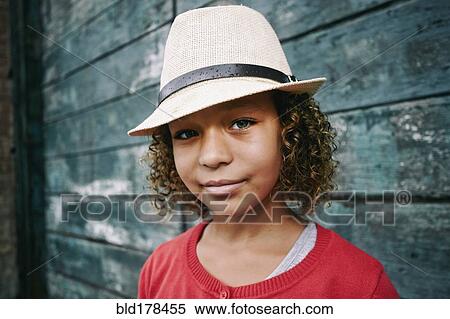 Stock Photography - Mixed race girl wearing fedora. Fotosearch