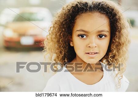 Mixed race girl with serious expression View Large Photo Image Picture - Mixed race girl with serious expression. Fotosearch