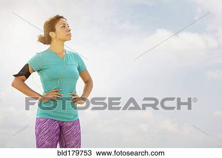 Mixed race runner standing outdoors View Large Photo Image Stock Image - Mixed race runner standing outdoors. Fotosearch