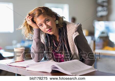 Mixed race student studying at table View Large Photo Image Stock Photography - Mixed race student studying at table. Fotosearch