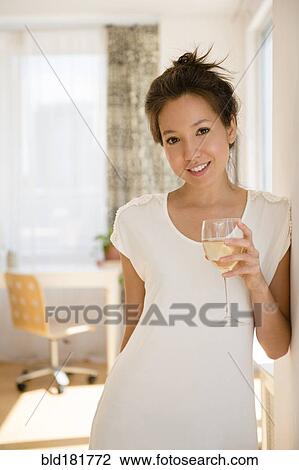 Mixed race woman drinking wine View Large Photo Image Stock Image - Mixed race woman drinking wine. Fotosearch