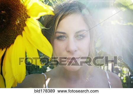 Stock Photo - Mixed race woman in garden. Fotosearch
