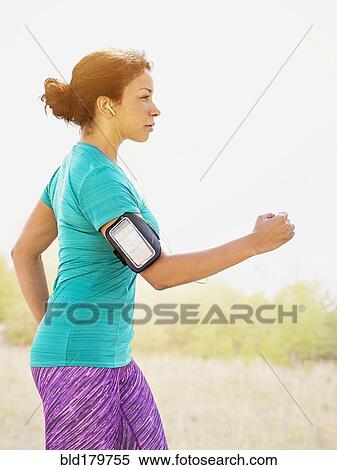 Mixed race woman jogging outdoors View Large Photo Image Stock Photography - Mixed race woman jogging outdoors. Fotosearch