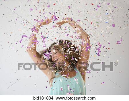 Mixed race woman playing in confetti View Large Photo Image Picture - Mixed race woman playing in confetti. Fotosearch
