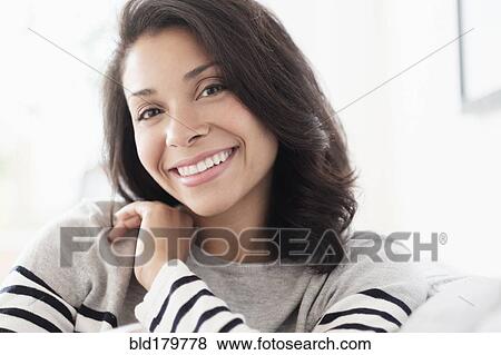 Mixed race woman smiling indoors View Large Photo Image Stock Photo - Mixed race woman smiling indoors. Fotosearch