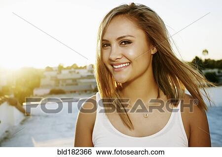 Mixed race woman smiling outdoors View Large Photo Image Stock Photograph - Mixed race woman smiling outdoors. Fotosearch