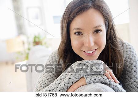 Stock Photo - Mixed race woman smiling. Fotosearch