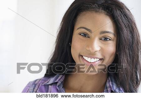 Stock Photograph - Mixed race woman smiling. Fotosearch