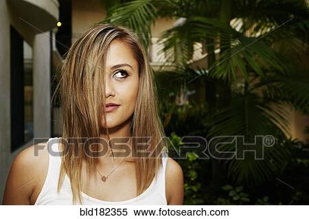 Mixed race woman standing outdoors View Large Photo Image Stock Photography - Mixed race woman standing outdoors. Fotosearch