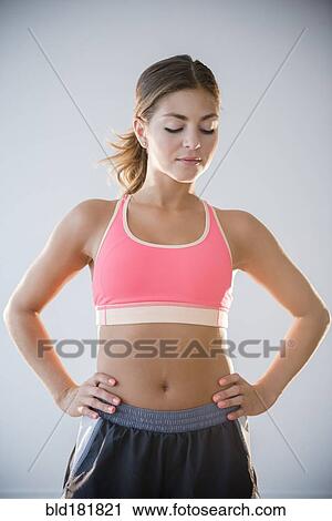 Stock Image - Mixed race woman standing. Fotosearch