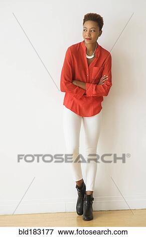 Mixed race woman standing with arms crossed View Large Photo Image Stock Photo - Mixed race woman standing with arms crossed. Fotosearch
