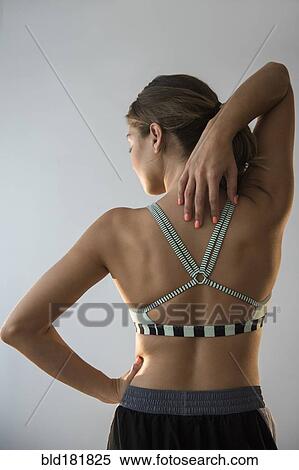 Stock Photography - Mixed race woman stretching. Fotosearch