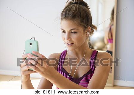 Mixed race woman using cell phone View Large Photo Image Stock Image - Mixed race woman using cell phone. Fotosearch