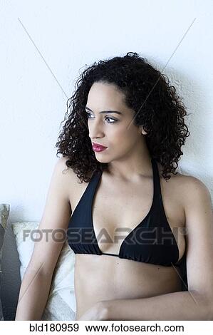 Mixed race woman wearing bikini View Large Photo Image Stock Photo - Mixed race woman wearing bikini. Fotosearch