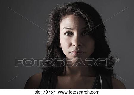 Mixed race woman with serious expression View Large Photo Image Stock Photo - Mixed race woman with serious expression. Fotosearch