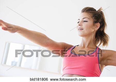 Stock Photograph - Mixed race woman working out. Fotosearch
