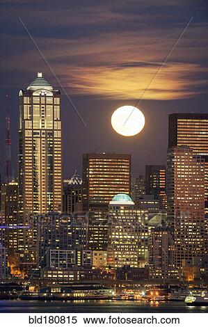 "Moon and high rise buildings over Seattle waterfront, Washington, United States" View Large Photo Image Stock Photography - "Moon and high rise buildings over Seattle waterfront, Washington, United States". Fotosearch