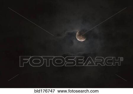 Moon glowing in night sky View Large Photo Image Stock Photo - Moon glowing in night sky. Fotosearch