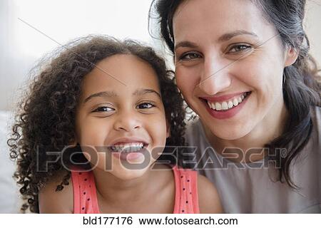 Mother and daughter smiling View Large Photo Image Stock Photograph - Mother and daughter smiling. Fotosearch