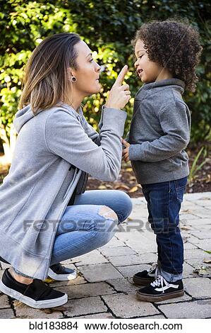 Picture - Mother and son playing outdoors. Fotosearch