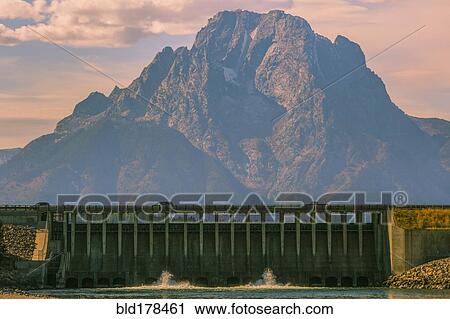 Mountain and dam in remote landscape View Large Photo Image Stock Image - Mountain and dam in remote landscape. Fotosearch