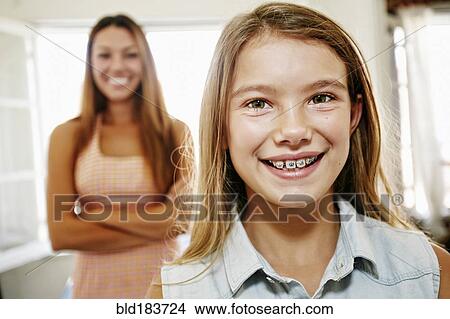 Picture - Native American girl smiling with braces. Fotosearch