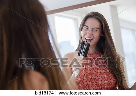 Native American woman singing with hairbrush View Large Photo Image Stock Image - Native American woman singing with hairbrush. Fotosearch