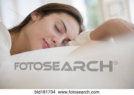Picture - Native American woman sleeping in bed. Fotosearch
