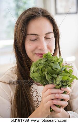 Native American woman smelling herbs View Large Photo Image Stock Photo - Native American woman smelling herbs. Fotosearch