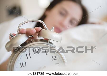Native American woman turning off alarm View Large Photo Image Stock Photography - Native American woman turning off alarm. Fotosearch