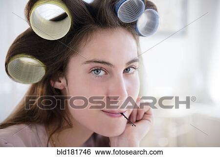 Stock Photograph - Native American woman with curlers in hair. Fotosearch