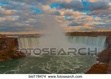 Picture - Niagara Falls mist under cloudy sky, Ontario, Canada. Fotosearch