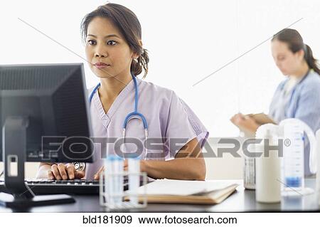 Stock Photo - Nurse using computer in hospital. Fotosearch