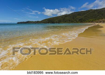 Stock Photography - Ocean waves on remote beach. Fotosearch