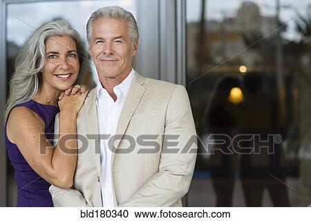 Stock Image - Older Caucasian couple hugging. Fotosearch